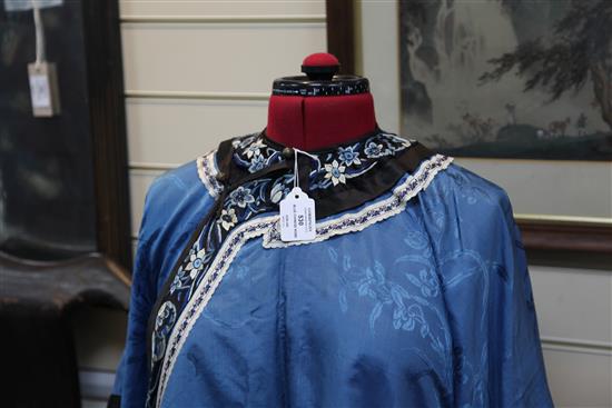 A Chinese blue silk, damask and embroidered ladys robe, late 19th / early 20th century,